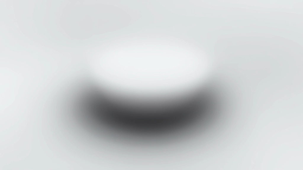 Nahaufnahme eines gut gestalteten Buttons mit mehrschichtigen Schatten, zeigt die Raised-Effekt-Illusion mit subtilen Highlights und Schatten